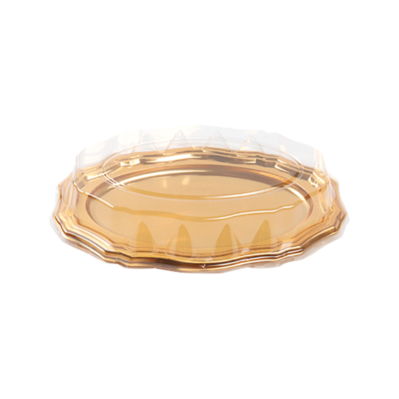 金色のプラスチックのケーキトレイ